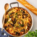 A steaming bowl of Linguine Frutti di Mare seafood pasta