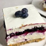 No-Bake Blueberry Cheesecake Bars layered on a platter